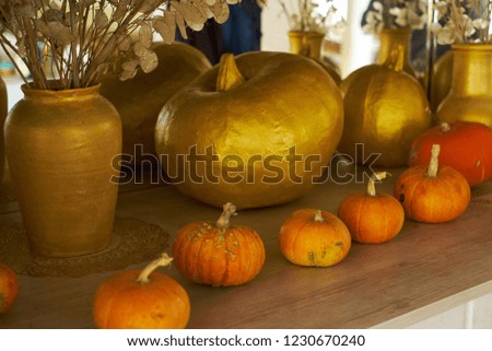 beautiful autumn composition with pumpkins. autumn cozy still life. pumpkins, autumn leaves and candles on wooden background. soft focus, top view