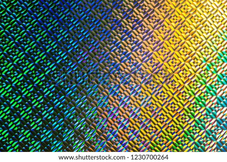 Texture of colored foil with holographic effect. Christmas, New Year, holiday, festival, carnival background