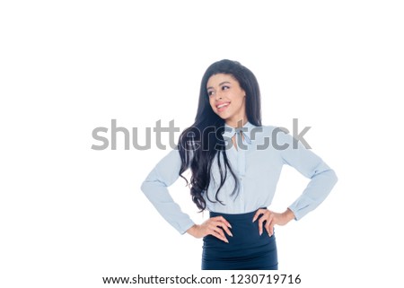 happy african american businesswoman posing with hands on waist isolated on white
