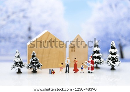 Miniature Santa Claus and children happy feeling on Christmas day, gift for everyone.