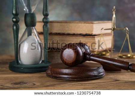 Lawyers office background. Law symbols composition on gray stone background.
