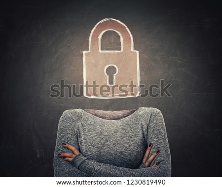 Surreal image young woman with crossed armss and lock icon instead of head drawn over blackboard background. Padlock as security symbol in business. Data privacy protection concept.