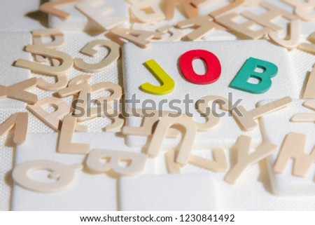 Jobs search concept, colourful wooden text word "Jobs"