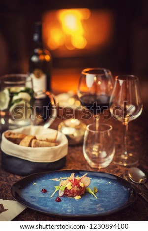 Tartare steak with a glass of wine and toasts, product photography for the restaurant, modern gastronomy