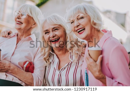 Waist up portrait of three positive older women joking and having fun together Royalty-Free Stock Photo #1230917119