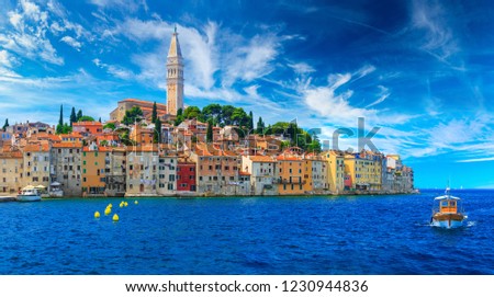 Wonderful romantic old town at Adriatic sea. Boats and yachts in harbor at magical summer. Rovinj. Istria. Croatia. Europe. Royalty-Free Stock Photo #1230944836