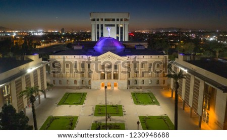 Blue light illuminates the roof of the Arizona Capitol building in Phoenix USA Royalty-Free Stock Photo #1230948688