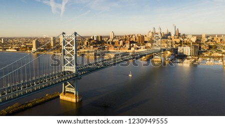 Blue sky over the Benjamin Franklin Bridge into downtown Philadelphia Pennsylvania