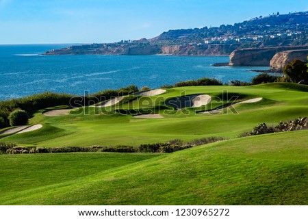 The Trump National Golf Course, in Rancho Palos Verdes along the Pacific coast of California, opened in 2006. Fairway and greens with lakes, sand traps are seen, ocean background with cliffs, bluffs.