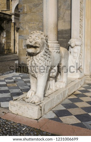 ITALY, BERGAMO - November 4, 2018: Sculpture of lion at the entrance to the Basilica of Santa Maria Maggiore in Bergamo