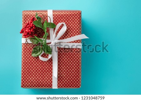red gift box on blue background. copyspace