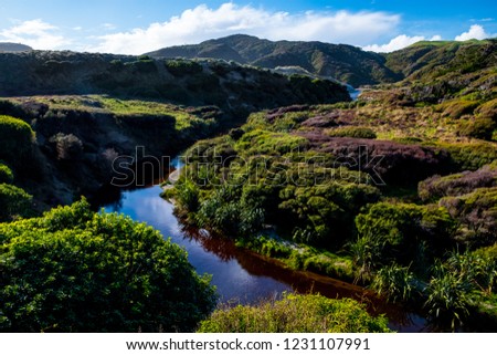 Beautiful landscape of the mountain and stream with blue sky and cloud.