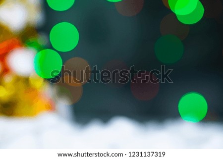 Colorful blurred bokeh background with snow.