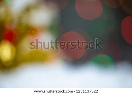 Colorful blurred bokeh background with snow.