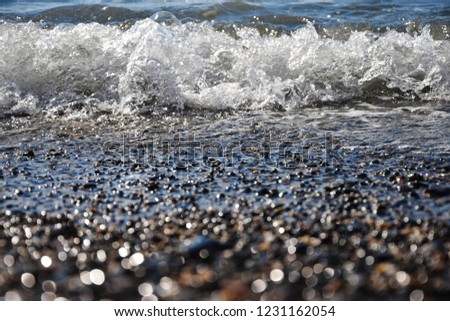 small waves on a pebble beach on the black sea
