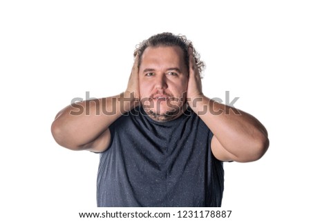 Man covering his ears witn hands, closing his eyes, isolated on white background. Hear no evil concept. Emotions facial expressions and communication signs