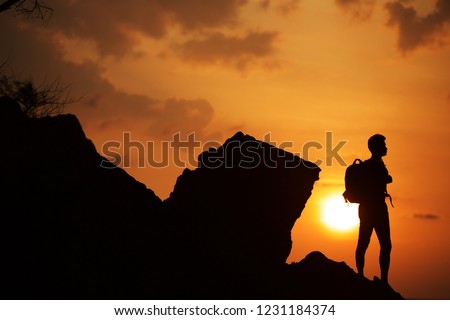 One Moment On The Rock in beach When sunset So Beautiful holiday moment in your time siting for thinking post for relaxing yoga thaiperformance time in silhouette pictures