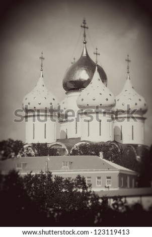 Church Domes in Trinity Sergius Lavra, Sergiev Posad, Russia. UNESCO World Heritage Site. Vintage style sepia photo.