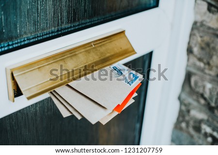 Post in the door mailbox Royalty-Free Stock Photo #1231207759