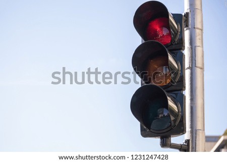 Red traffic lights for cars, blue sky background, copy space