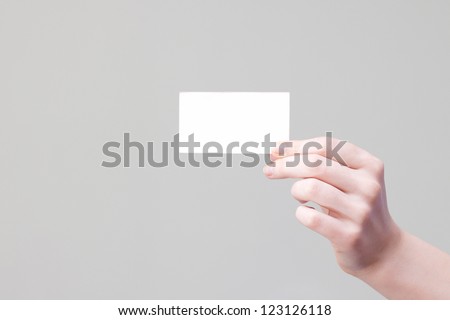 bussines card in hand for your information and logo in a grey background