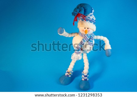 toy snowman on a blue background