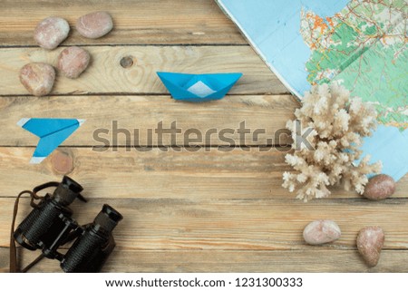 Accessories for travel top view on wooden background with copy space. Adventure and wanderlust concept image with travel accessories. Preparing for an exotic trip, journey and sightseeing