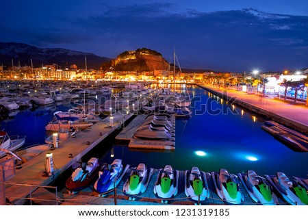 Denia sunset with castle and marina at Alicante in Spain Royalty-Free Stock Photo #1231319185