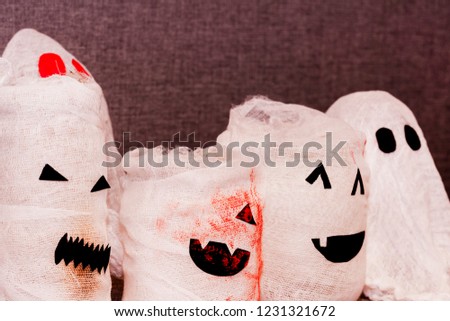 close-up Images of a ghost on a dark background. Couple of white sheet ghost. Concept our fears and nightmares