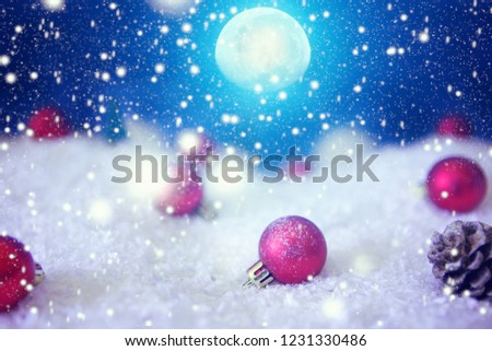 Christmas card with a winter forest and christmas decorations in a moonlit night. The elements of this image furnished by NASA.