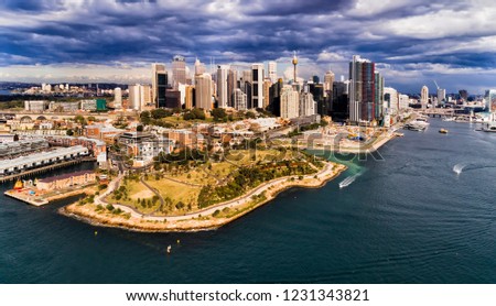 Millers point on shore of Sydney Harbour at The Rocks historic suburb in front of High-rise towers of city CBD and Barangaroo.