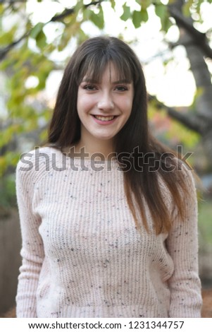 Portrait of a beautiful teenage girl. Outdoor portrait of young woman 