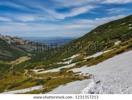 Breathtaking view of Tatra National Park with mountains in sunny spring day with blue sky nearby Zakopane village, Poland
