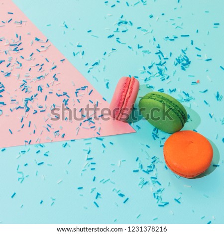 Heap of colorful almond macaroons or cookies with confetti. sharp shadows, close up   