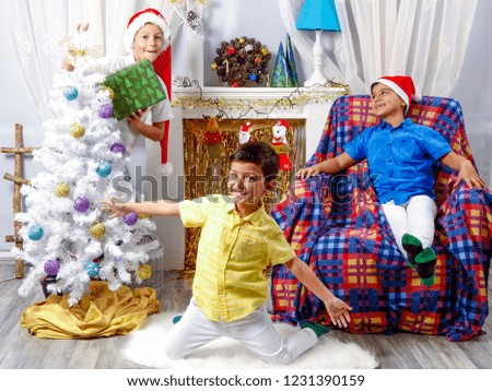 Happy children playing in Christmas decorative room