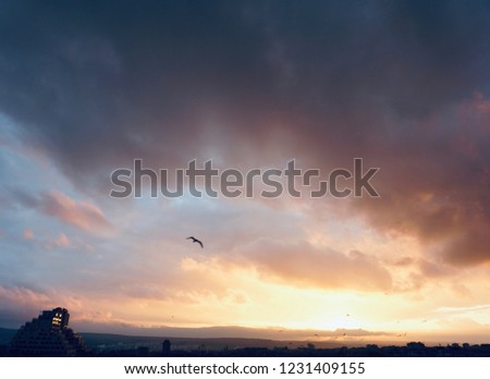 Beautiful evening sky landscape. Dramatic clouds above the city of Varna. Amazing view. Natural light. Sunset background.