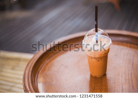 Thai Ice Tea on the table in the shop.