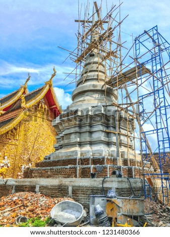 This image shows the construction of a Buddhist pagoda. This picture was taken at a temple in Lampang, Thailand.