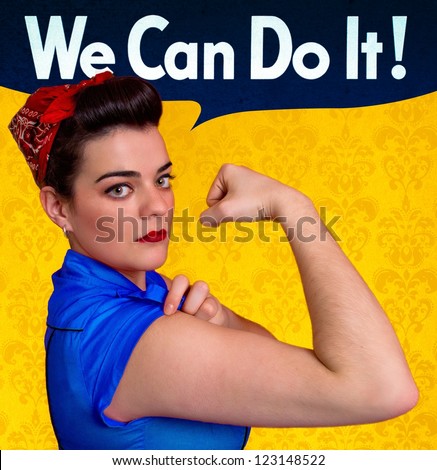 Beautiful young woman posing as working girl and representing the ideals of the original poster of Rosie the Riveter, year 1943 Royalty-Free Stock Photo #123148522