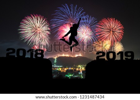 a woman jumping from year 2018 to year 2019.background is firework and mountain.