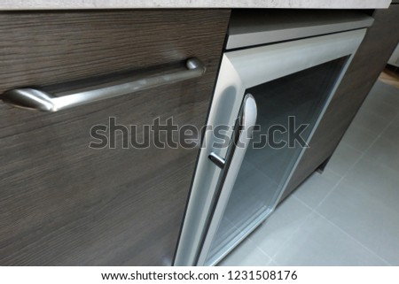 Wine Cooler under kitchen counter top with stainless steel handle 