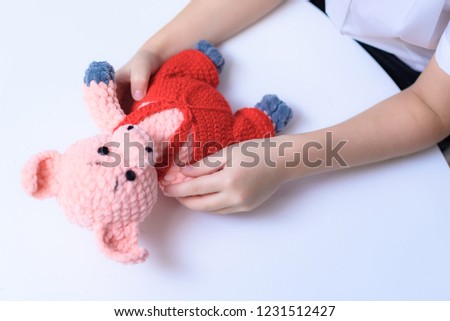 concept hands of a child draw play with a toy.