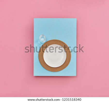 Pink and blue background service knife fork and plate style.