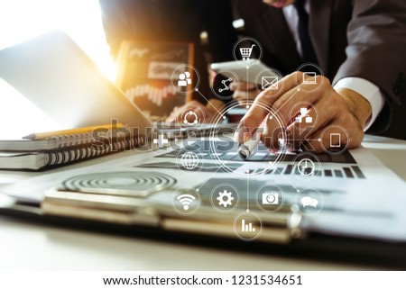 Business team present. professional investor working new start up project. tablet laptop computer with digital marketing media  in virtual icon design Finance managers meeting.
 Royalty-Free Stock Photo #1231534651