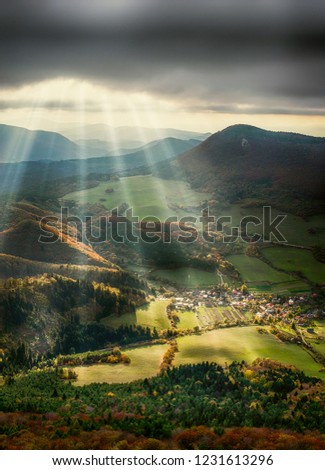 Vertical panorama of the landscape. HDR and HD background effect on the phone. Hills and forests during autumn with sunset and sunbeams.