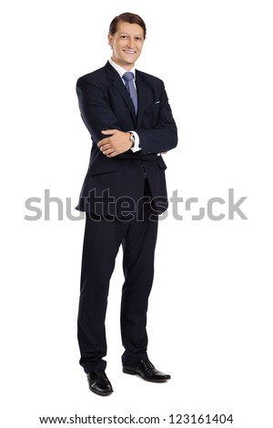 Photo of an attractive businessman with his arms crossed and smiling over a white background.