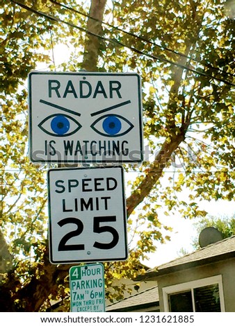 Radar watching, 25 mph speed limit and 4 hour parking signs.