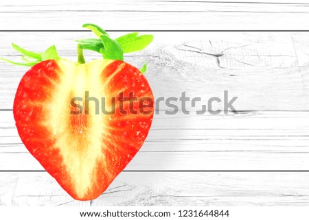 red strawberry slice in heart shape for heart health,health related concept in wooden background with copy space