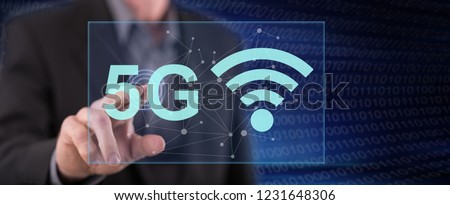 Man touching a 5g concept on a touch screen with his finger Royalty-Free Stock Photo #1231648306