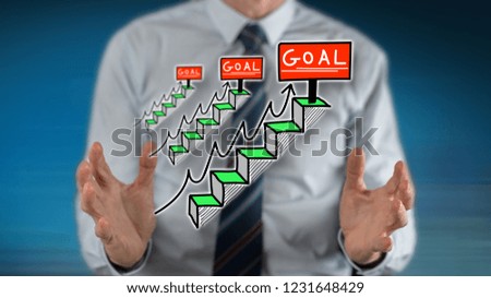 Goal concept between hands of a man in background